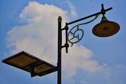 Sky view with street light illuminated in the sunset