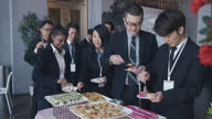 istock Asian Multiracial Seminar participants picking up food and drink in business conference meeting coffee break 1641516789