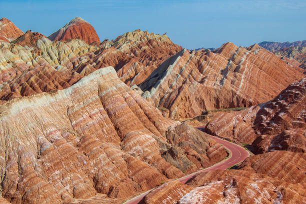 istock Curvy road through the colorful rainbow mountains. China 1641537165