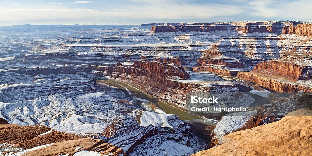 Dead Horse Point Overlook Wintry view of a gooseneck bend in the Colorado River from the overlook in Dead Horse Point State Park Utah. Canyon Stock Photo