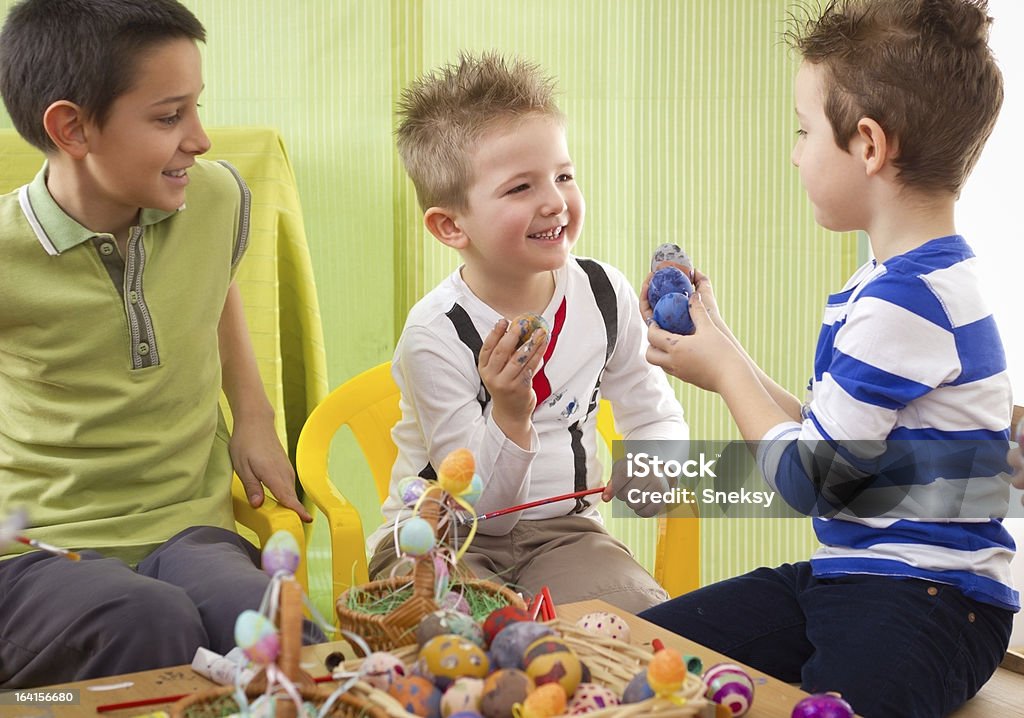 Having fun while painting easter eggs Group of children painting easter eggs Animal Egg Stock Photo