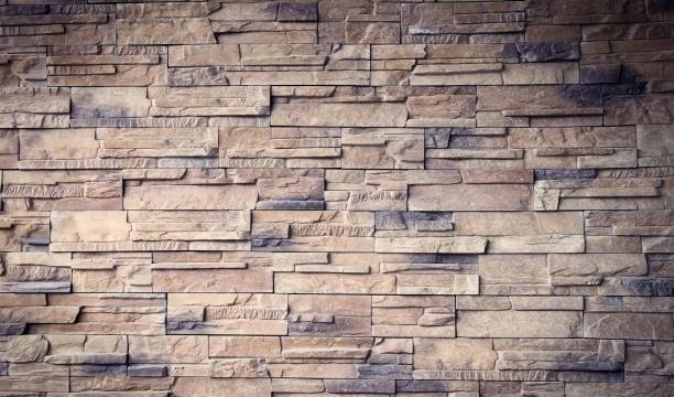 istock a photography of a brick wall with a fire hydrant in front of it, wall clock with a brick pattern on it in front of a brick wall. 1641574343