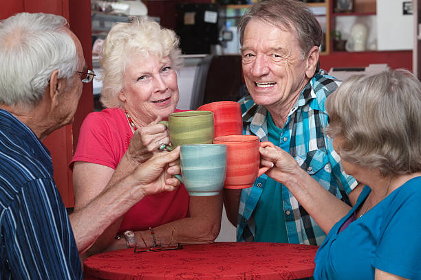 istock Senior Adults Toasting with Mugs 164160089