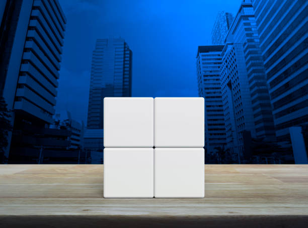 istock Four white block cubes on wooden table 1641604966
