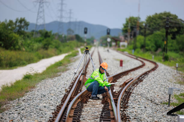 istock Engineer use theodolite equipment surveying construction worker on Railway site. 1641611825