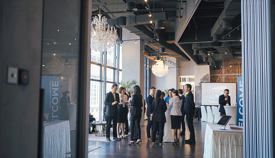 Asian Multiethnic business people talk during a coffee break in Seminar Business conference