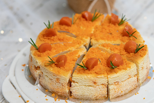 beautiful Salted Egg Cheesecake on a wooden desk