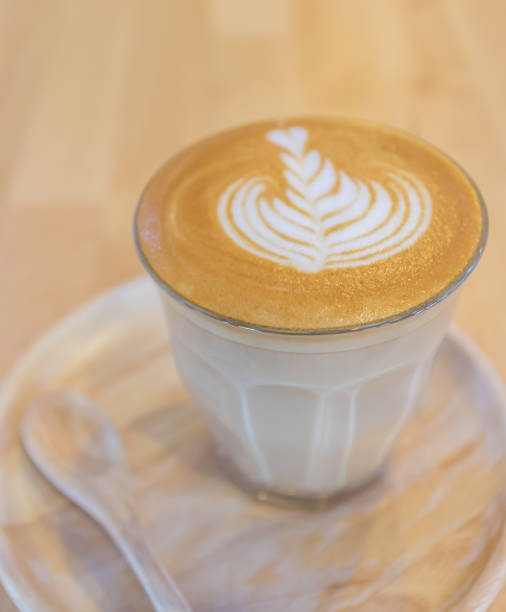 istock milk coffee in a glass on a wooden table 1641643254
