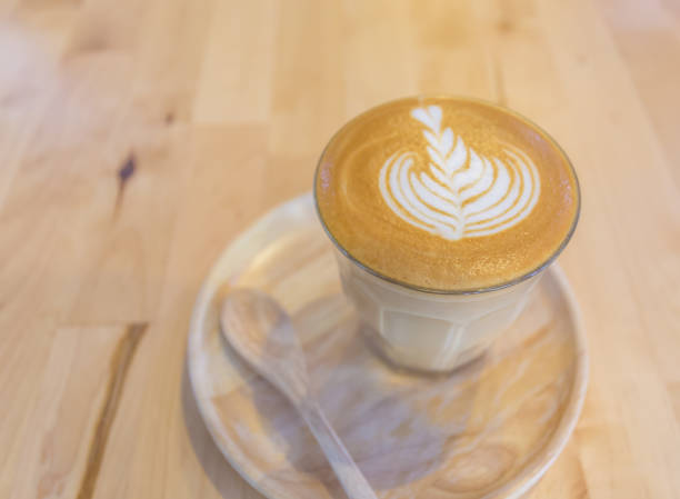 istock milk coffee in a glass on a wooden table 1641653422