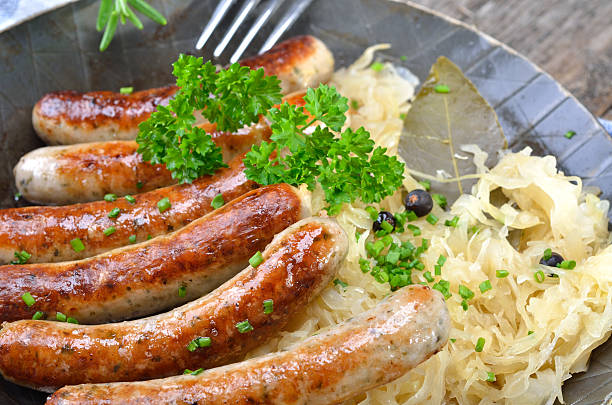 istock Fried sausages on sauerkraut 164165910