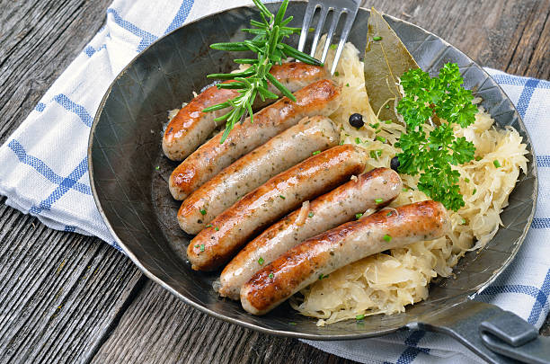 istock Fried sausages on sauerkraut 164165917