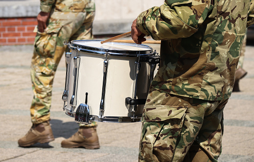 Soldier drummer marching in a row outdoor