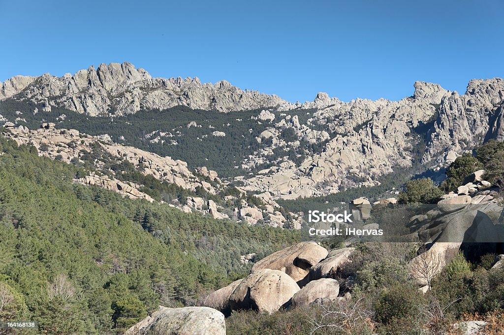 Views of La Pedriza, Madrid, Spain. It is a granite mountain where geological forces have create a remarkable boulder field of strangely eroded granite outcrops.  Boulder - Rock Stock Photo