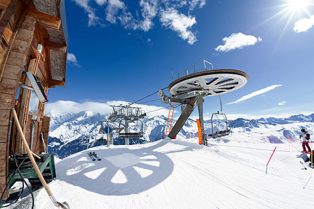 istock Ski chair-lift arrival in alpine mountain 164170468