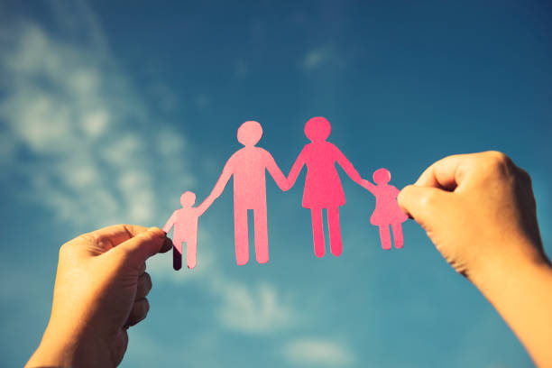 istock Family paper dolls against the sky 164171175