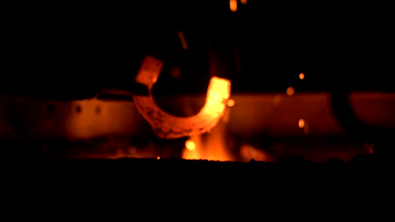 HD: Blacksmith Heating A Horseshoe