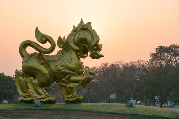 Lion temple protectors.  This sculpture made of bricks and lime and painted in white or gold is generally seen in front of the temple throughout the north of Thailand, isolated on white background