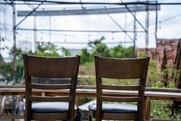 Wooden deck at rooftop city with Adirondack chairs