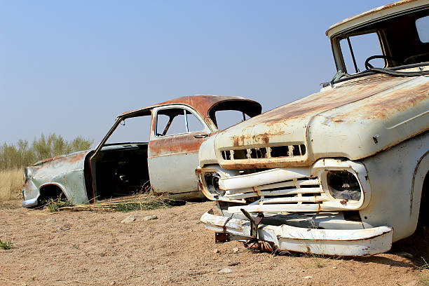 istock Rusty car wreck at last gas station before the Namib 164175828