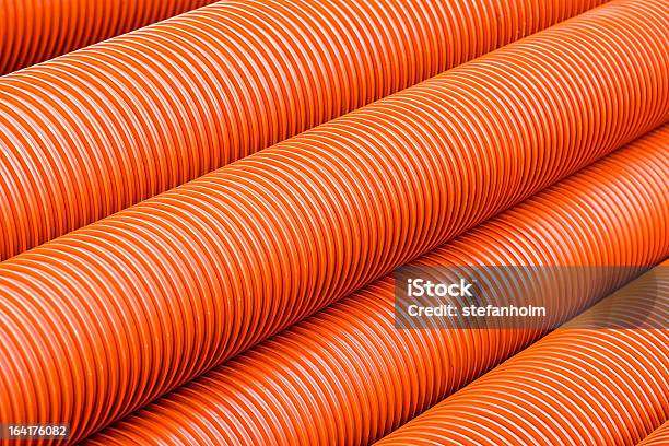 Tuberías De Plástico Pvc Naranja Foto de stock y más banco de imágenes de Abstracto - Abstracto, Boca de alcantarilla, Bulto