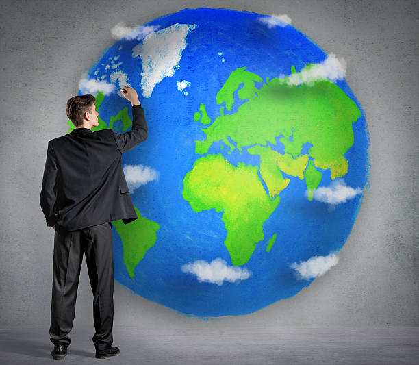istock Businessman drawing a planet on wall 164176145