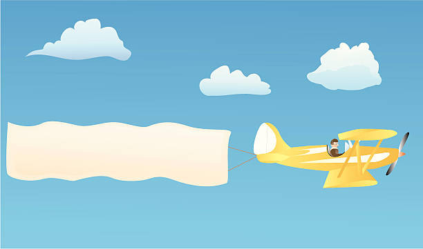 Biplane with blank banner Biplane hauling blank advertisement banner to put your own words on words in the sky stock illustrations