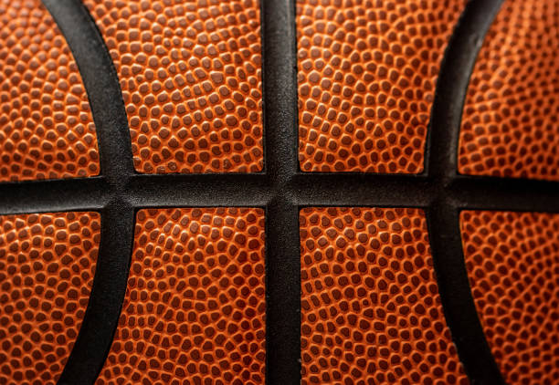 istock Orange basketball ball texture background close-up. 1641817636