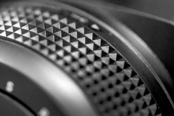 Close-up of lens, side view, black background