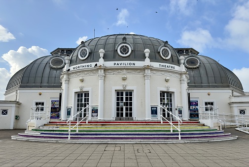 Worthing, UK - August 12, 2023: Worthing Pavilion Theatre, built in 1926, on the seafront in the British seaside resort of Worthing, West Sussex, England.