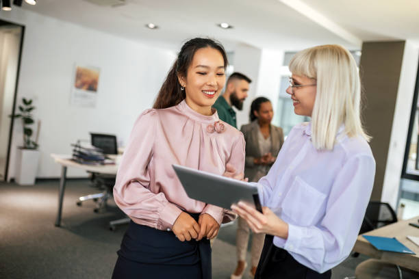 istock A business team is standing in a modern office and having a discussion 1641855222