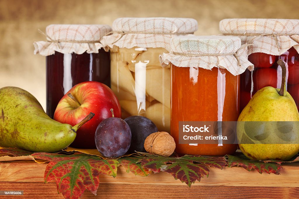 Fruit preserves Close view of compotes and jam in glass bottle with fresh fruits Apple - Fruit Stock Photo