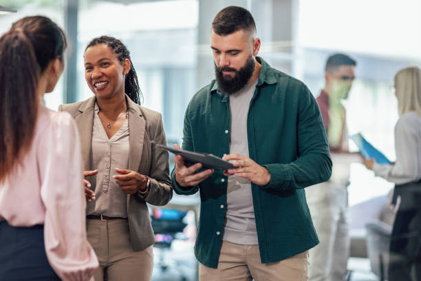 istock A business team is standing in a modern office and having a discussion 1641858328