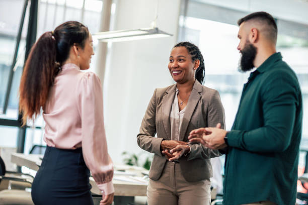 istock A business team is standing in a modern office and having a discussion 1641858329