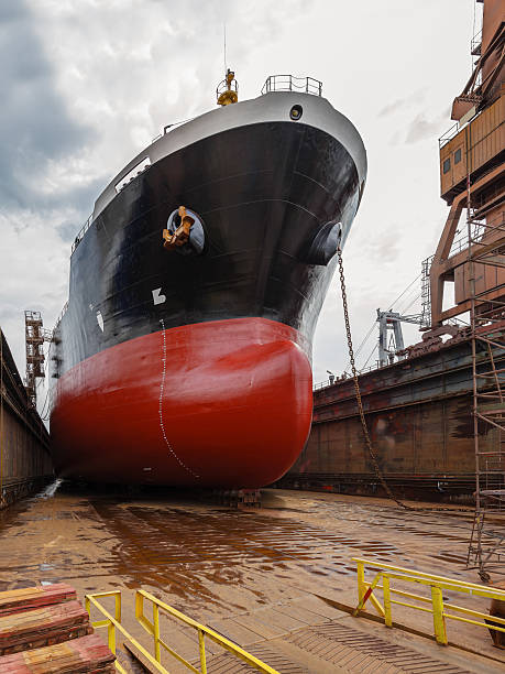 Tanker in dry dock A large tanker ship is being renovated in shipyard Gdansk, Poland. dry dock stock pictures, royalty-free photos & images