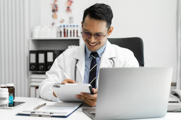 istock Doctor work on digital tablet healthcare doctor technology tablet using computer in a modern office in the morning at the desk. 1641891516