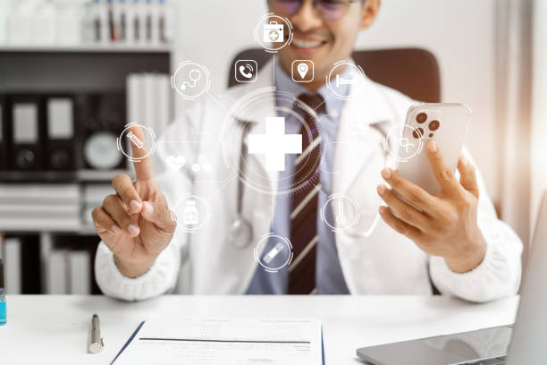 istock Medicine doctor hand working with modern digital smartphone and laptop computer interface as medical network concept. 1641891520