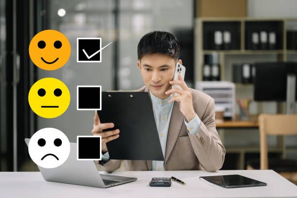 istock Happy Client customer experience concept. Businessman recording phone inquiry with checkboxes, smiling face rating excellent for satisfaction survey. 1641892061