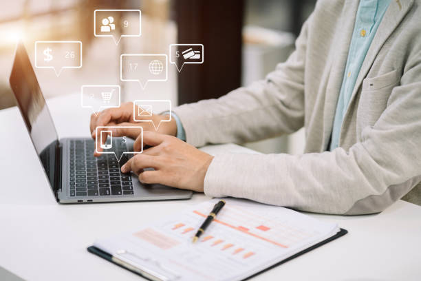 istock Businessman using laptop computer in office. Happy man, entrepreneur, small business owner working online. 1641892082