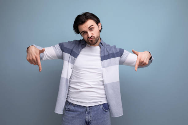 istock energetic smart brunette man rejoices at the decision 1641894730