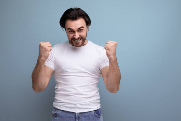 istock a strong young brunette guy in a white t-shirt won 1641894862