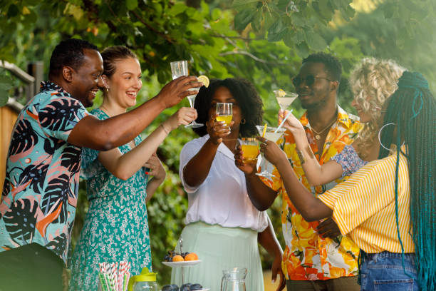 istock Friends cheering with their drinks during a fun garden party 1641902322