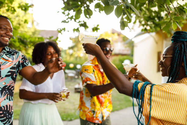 istock Friends enjoying drinks and dancing during a fun garden party 1641902336