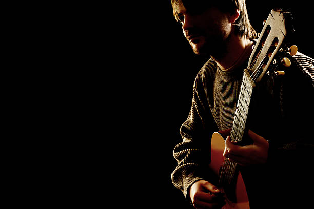 istock Acoustic guitar guitarist playing 164190783