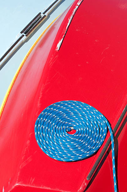 istock Blue rope coiled on red sailboat 164191932