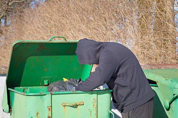 istock Homeless near waste containers 164192740