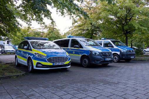 Braunschweig, Germany - 18th September, 2022: German police cars parked on a public parking. These vehicles are used to patrols on the streets.