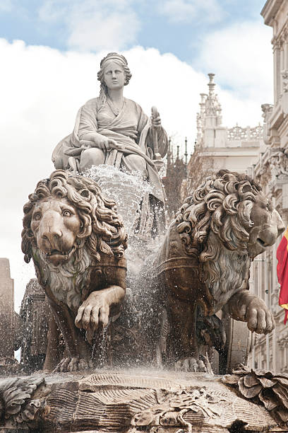 Fountain of Cibeles in Madrid The beautiful fountain of the Roman mother goddess Cibeles in a chariot pulled by two dramatic lions.   On the Castellana in central Madrid.  The old Post Office building, Correos, now the Town Hall is in the background. chariot photos stock pictures, royalty-free photos & images