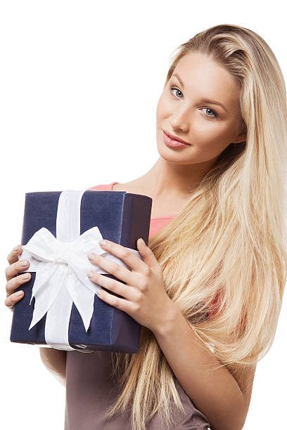 Blonde girl holding gift box stock photo