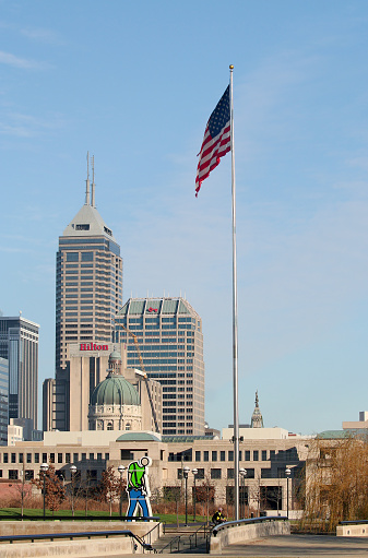 Indianapolis, IN, US-December 02,2006:Downtown with Skyscrapers and Giant US Flag