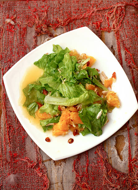 Salad with chicken, oranges, honey and almonds stock photo